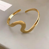 Arany hullámos klasszikus nyitott karkötő